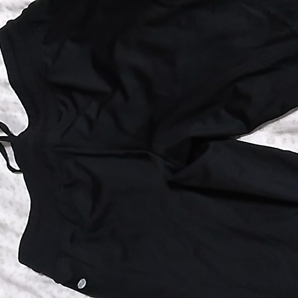 The pants are shiny and a slim jogger - Picture 3 of 8